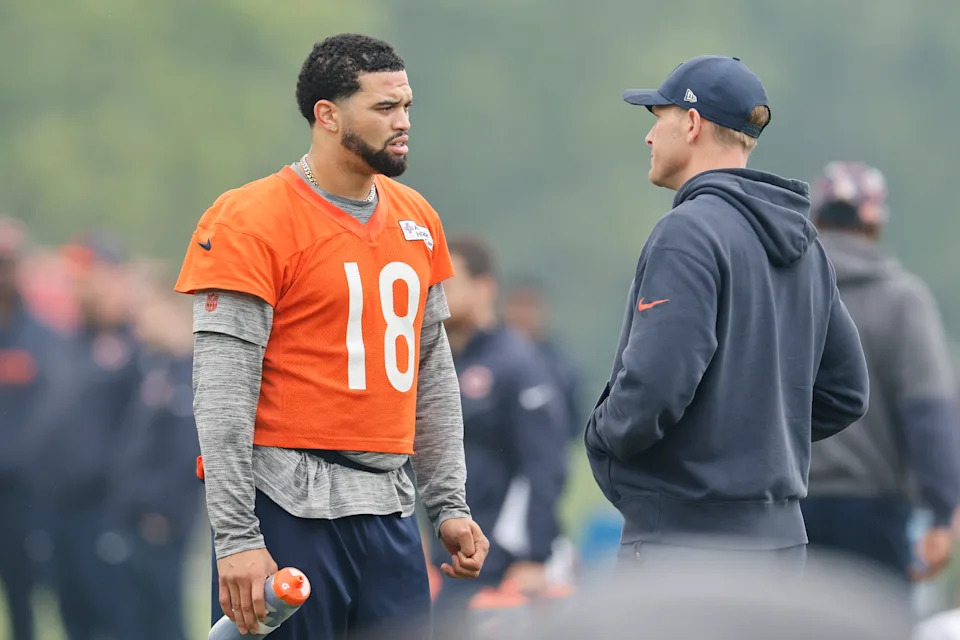 Caleb Williams of the Chicago Bears talks with head coach Ben Johnson during an offseason practice. (Photo by Michael Reaves/Getty Images)