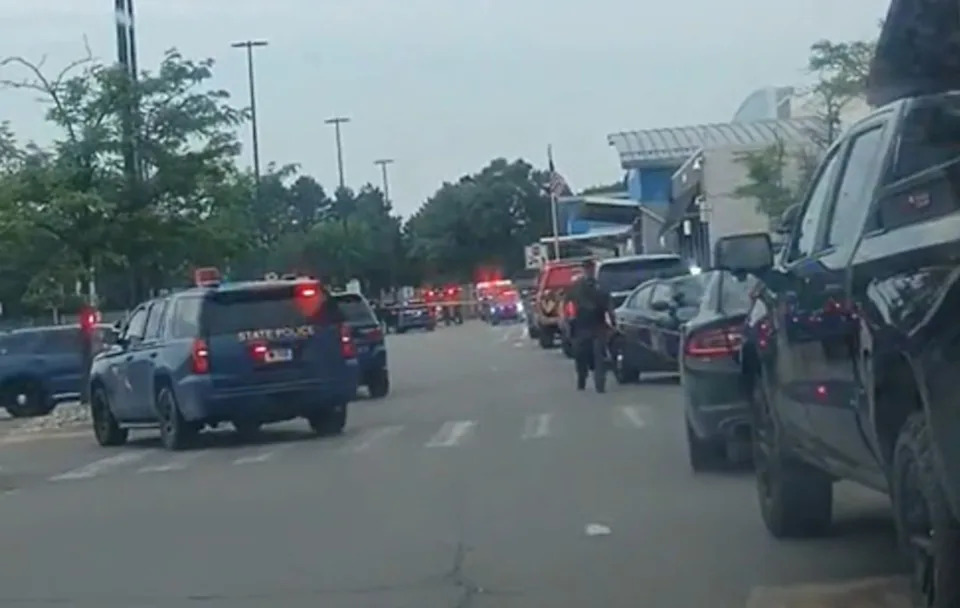 Police respond to the scene of a mass stabbing at a Traverse City, Mich., Walmart. (Tiffany DeFell)