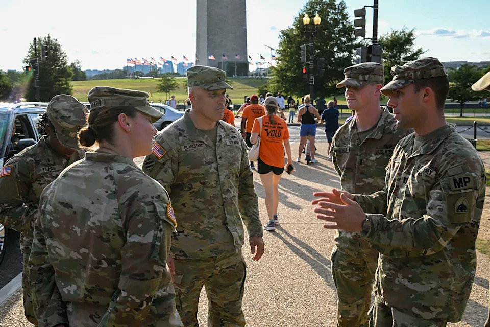 Staff Sgt. Deonte Rowell/U.S. Army - PHOTO: U.S. Army Brig. Gen. Leland D. Blanchard II, the Adjutant General of the District of Columbia Army National Guard, visits with soldiers assigned to the 273rd Military Police Company, during patrol operations at the National Mall, August 12, 2025.