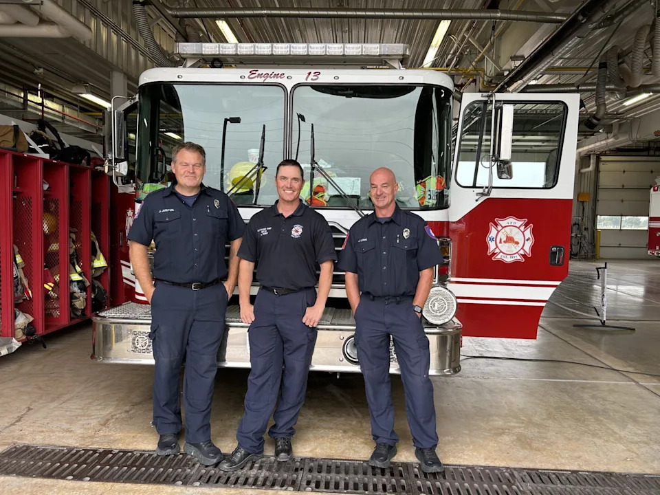 Amarillo Fire Department crew members Jeff Justus, Adam Perry and Jason Love stand in front of the fire engine that a rescue team traveled in recently to help Kerrville through the disaster suffered July 4, when flooding swept through the area including a church camp, killing over 100 people.