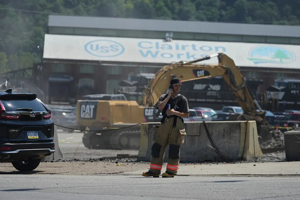 An emergency crew is seen after an explosion at the Clairton Coke Works, a U.S. Steel coking plant, Monday, Aug 11, 2025, in Clairton, Penn. (AP Photo/Gene Puskar)