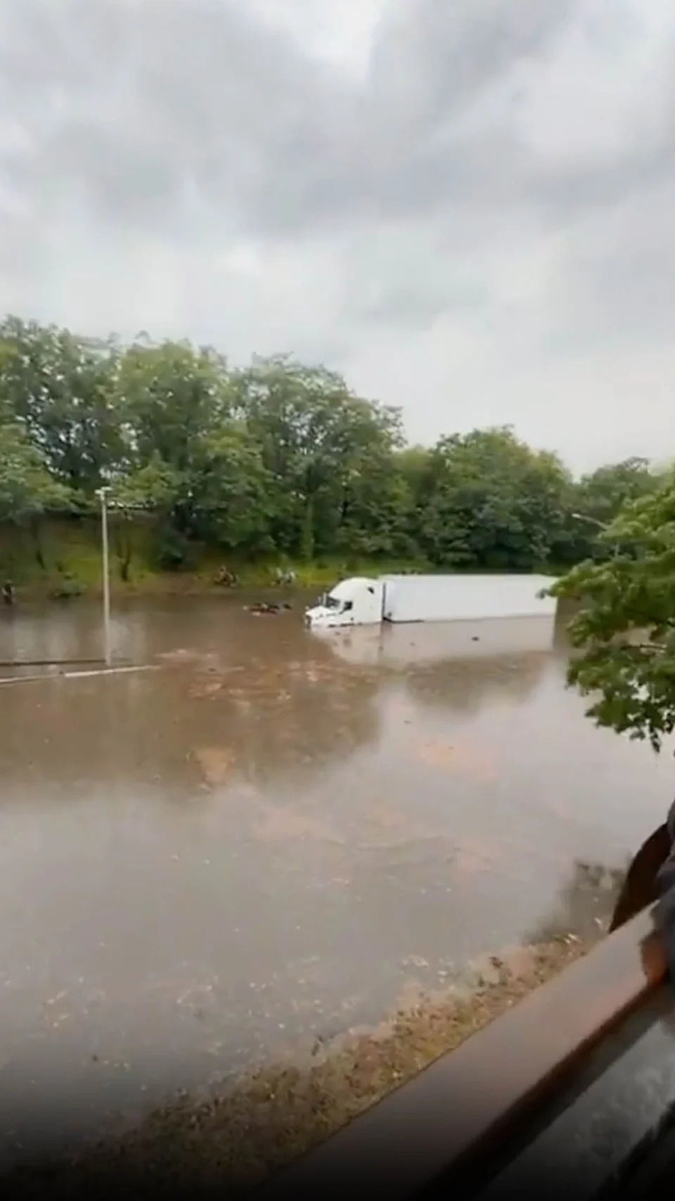 @mzcoldheart.caple/Facebook - PHOTO: A truck on the Clearview Expressway during flooding in New York, July 31, 2025.