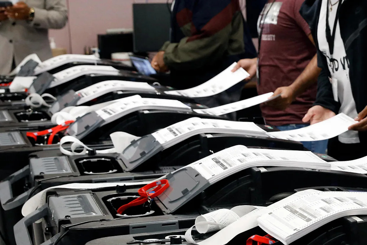 The Detroit Department of Elections performs a public accuracy test of its equipment, which is made by Dominion Voting Systems, in advance of a primary in 2022. (Jeff Kowalsky / AFP via Getty Images)