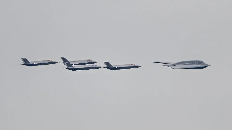 F-35 jets and a B-2 bomber accompany the plane carrying the Russian President Vladimir Putin as he arrives at Elmendorf-Richardson Joint Base ahead of Russian President Vladimir Putin and US President Donald Trump meeting in Alaska, United States on August 15, 2025. - Fatih Aktas/Anadolu/Getty Images
