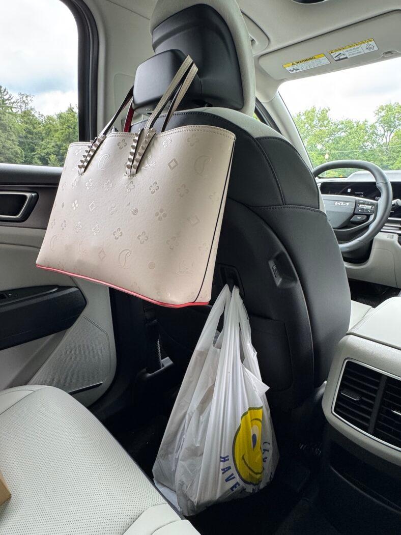 The rear seat in the 2026 Kia Sportage is loaded with places to hold things