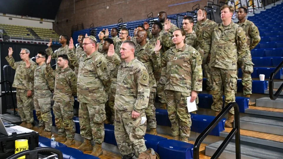 US soldiers assigned to the 273rd Military Police Company, Washington, DC National Guard, take the oath of office on August 12. - Staff Sgt. Deonte Rowell/US Dept. of Defense