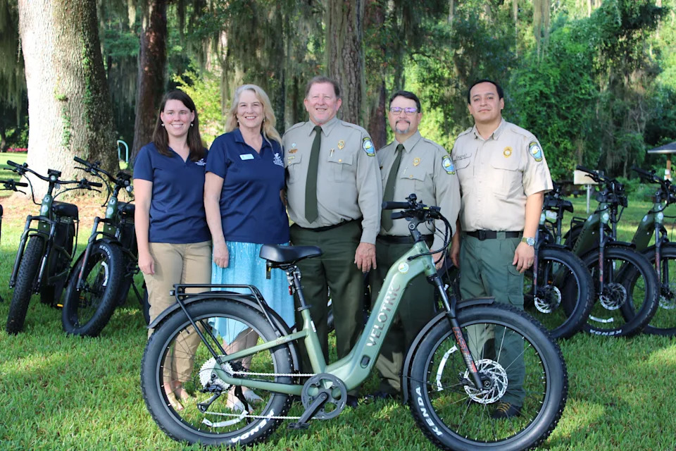 Florida Park Service and Florida State Parks Foundation members with new e-bikes at Maclay Gardens.