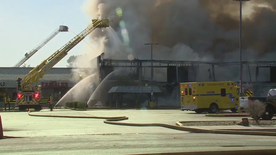 Clark County fire crews battle a large blaze at a business complex across the street from the UNLV campus on Maryland Parkway, near Tropicana Avenue on July 25, 2025. (KLAS)