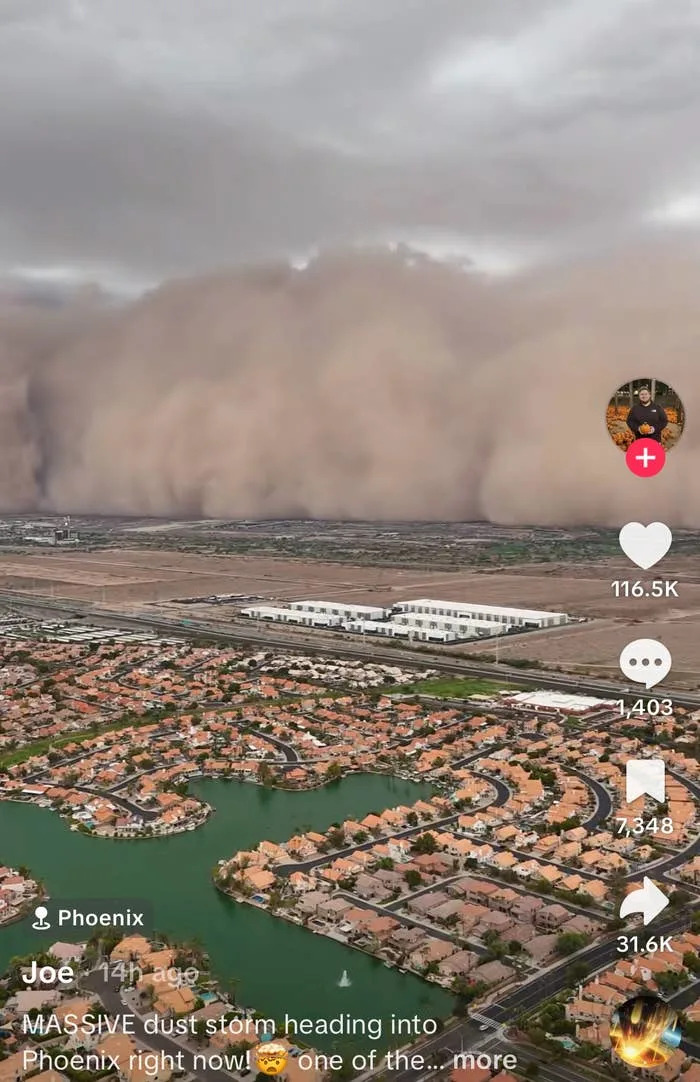 Massive dust storm approaches a suburban area in Phoenix, as seen in a TikTok video with engagement statistics on screen