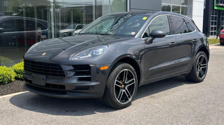 a 2/3s view of a grey 2020 Porsche Macan S parked outside of a dealership