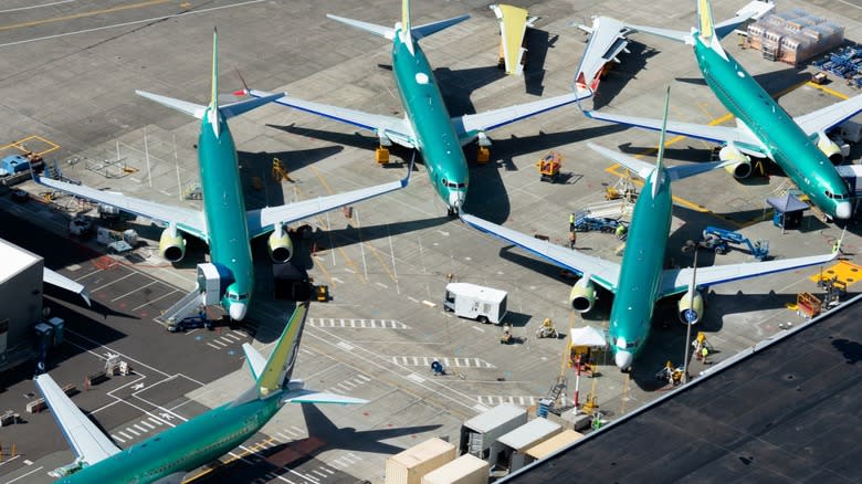 Several Boeing 737s sitting outside of factory in Renton, Washington