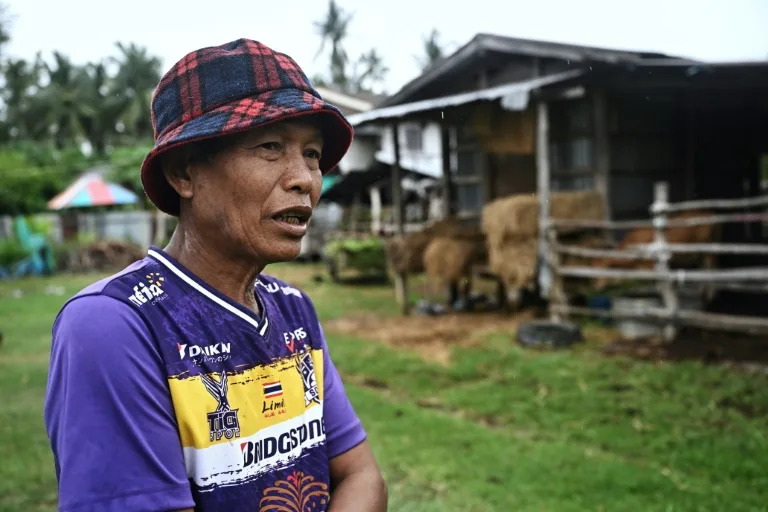 Farmer and village co-leader Keng Pitonam refuses to evacuate from his village despite ongoing clashes (Lillian SUWANRUMPHA)