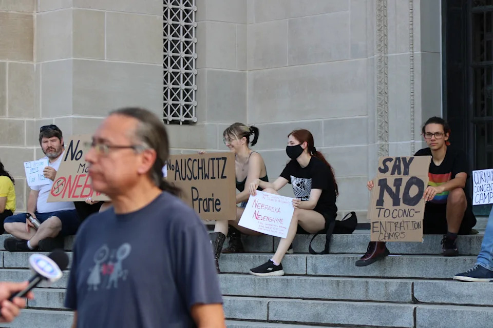 Kevin Abourezk talking to reporters at the Nebraska statehouse about the federal immigration detention center headed to McCook. Aug 19. 2025. (Juan Salinas II/Nebraska Examiner)
