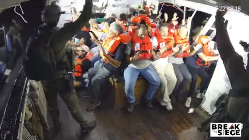 A still from a YouTube livestream shows armed Israeli personnel intercepting the Handala aid ship en route to Gaza. - Freedom Flotilla Coalition