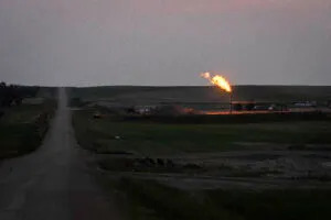  A gas flare in Williams County, North Dakota, in June 2025. (Sarahbeth Maney/ProPublica)