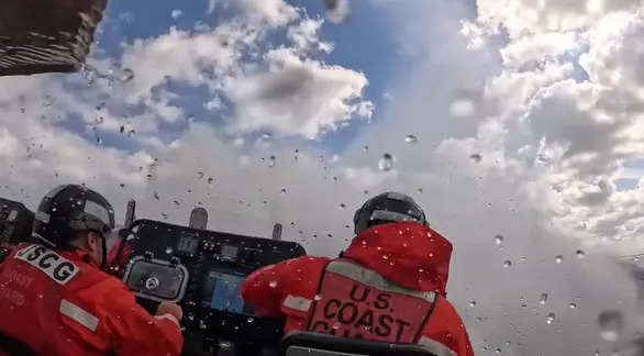 Ocean spray hitting the Coast Guard crew after the second wave.
