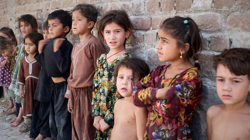 Afghan children wait in line to get a polio vaccine in Jalalabad, Afghanistan, in May. - Shafiullah Kakar/AP