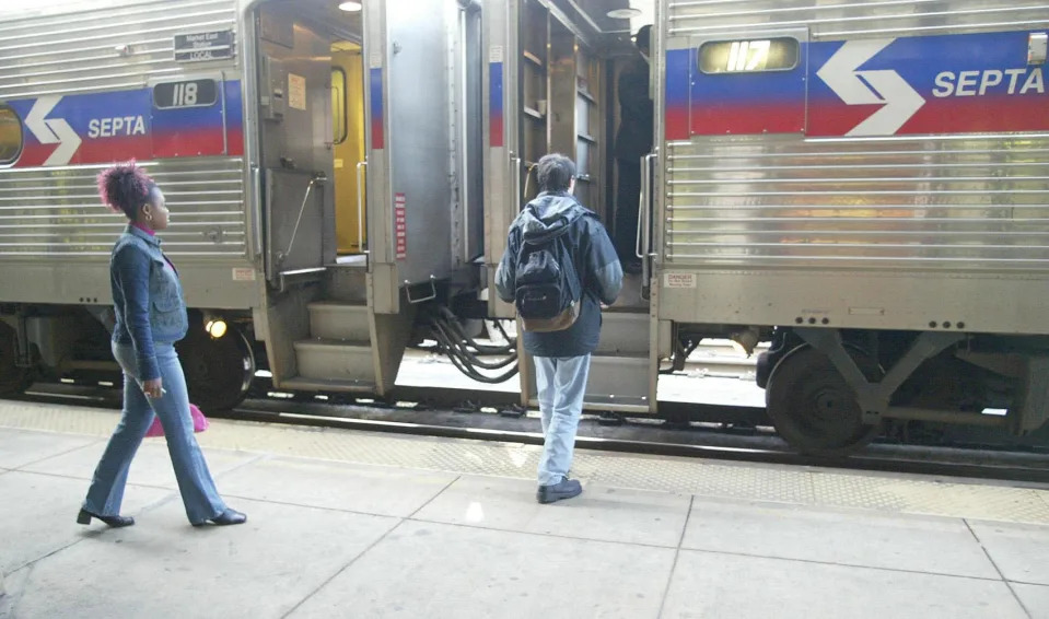 Passengers board a SEPTA train headed to Philadelphia from the train station in Wilmington in an undated photo.