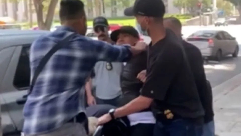 Man yells for help as apparent ICE agents carry him from LA courthouse into unmarked car, video shows