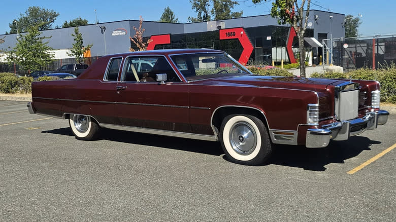 a Burgundy 1977 Lincoln Continental Town Coupe