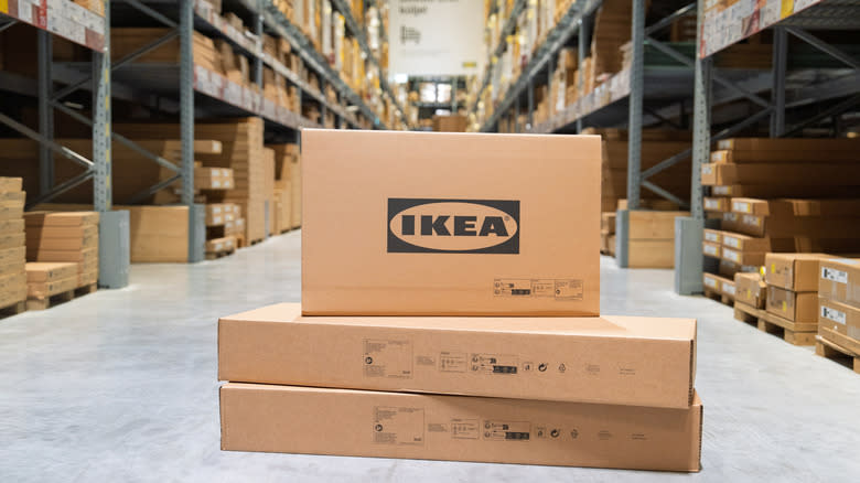 Ikea, A stack of cardboard boxes neatly arranged in a spacious warehouse, showcasing efficient logistics management for distribution and shipping operations.