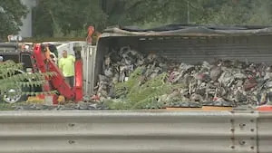 Part of I-495 in Merrimack Valley closed after truck rolls over, spills trash