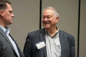 Then-State Sen.-elect Robert Hallstrom of Syracuse talks with State Sen. Ben Hansen of Blair at a legislative retreat in Kearney on Dec. 13, 2024. (Zach Wendling/Nebraska Examiner)