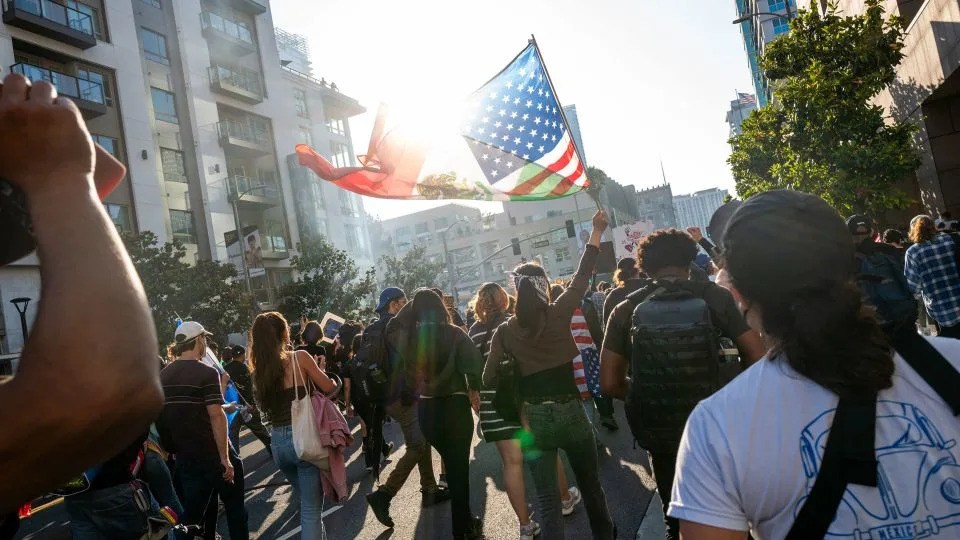 People protesting Immigration and Customs Enforcement (ICE) raids move through downtown Los Angeles on June 10. - Spencer Platt/Getty Images