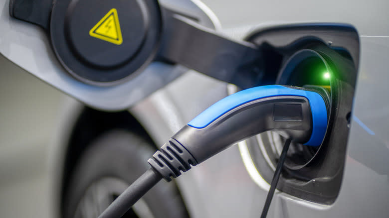 An EV charger plugged into a car