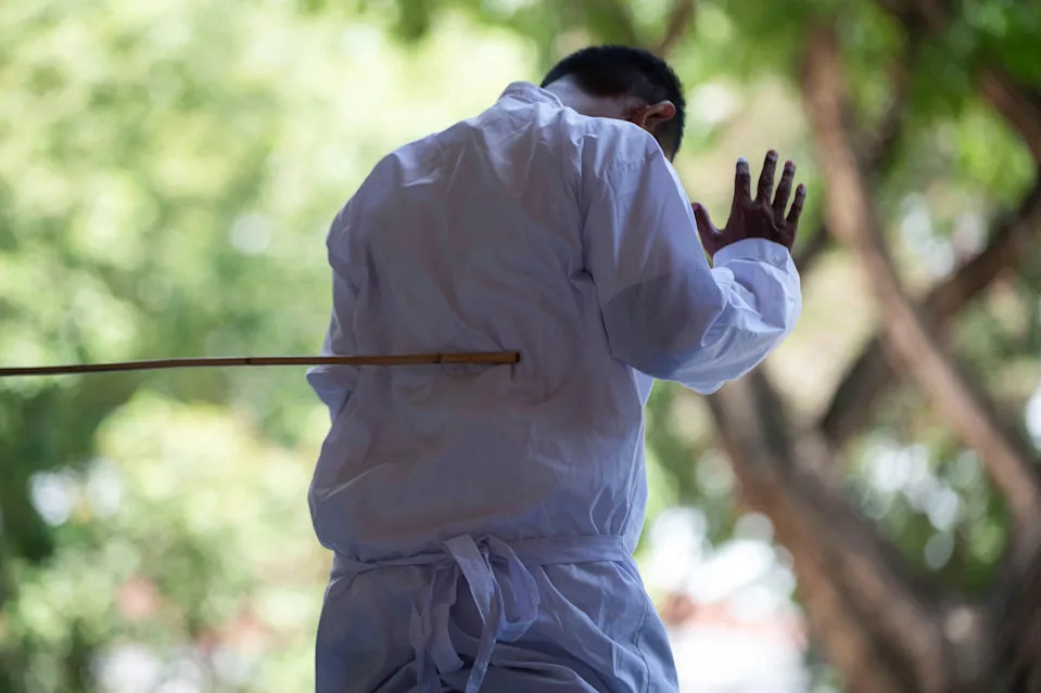 An Indonesian man convicted of immoral sexual activity is publicly caned by a Sharia law official in Banda Aceh, Indonesia, Aug. 26, 2025. / Credit: Riska Munawarah/REUTERS
