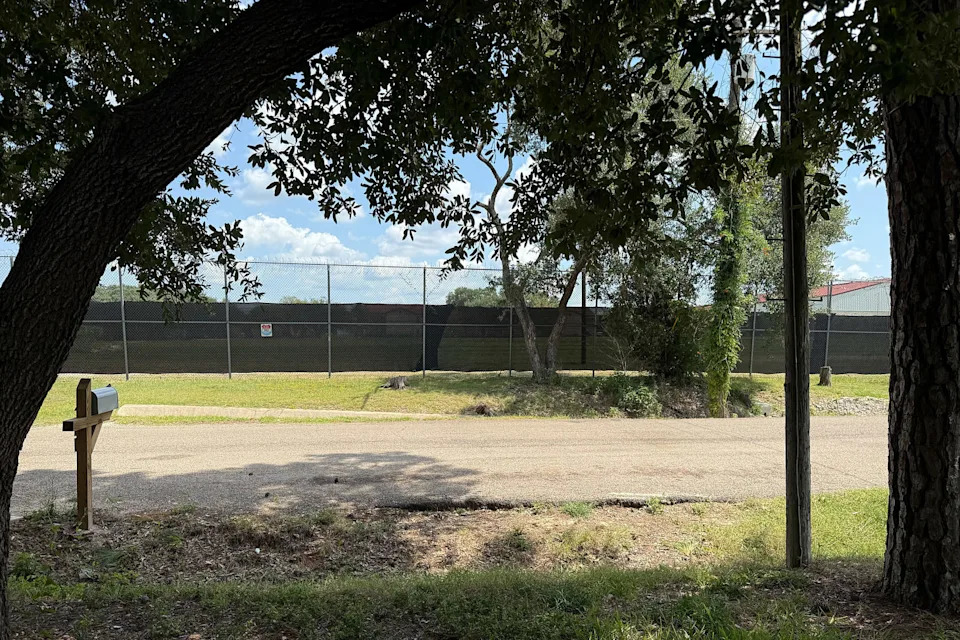 Dark privacy windscreens pinned up on fences circling the prison block public views of the running path on Friday. (Courtesy Marc Ybarra)