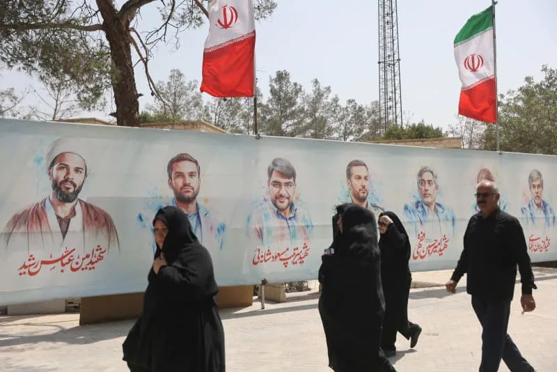 Pictures of Iranian military commanders, nuclear scientists and others killed in Israeli strikes are displayed in Behesht Zahra Cemetery in southern Tehran, Iran, July 11, 2025 (photo credit: Majid Asgaripour/WANA/via Reuters)
