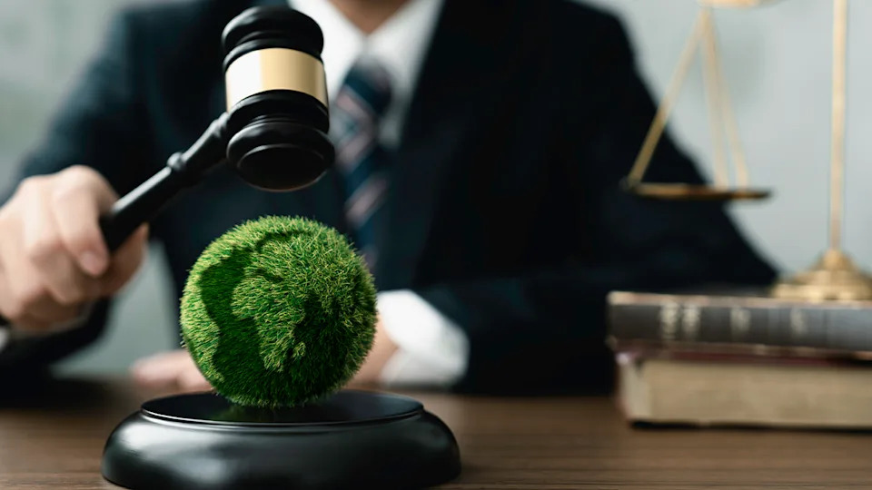 Man with gavel over world