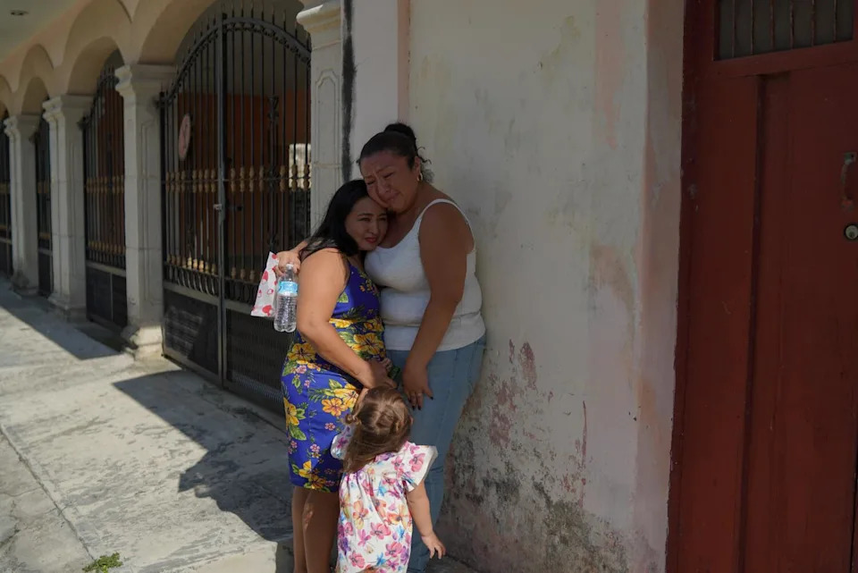 Noemi Ciau is comforted by her cousin Rocio after becoming emotional.