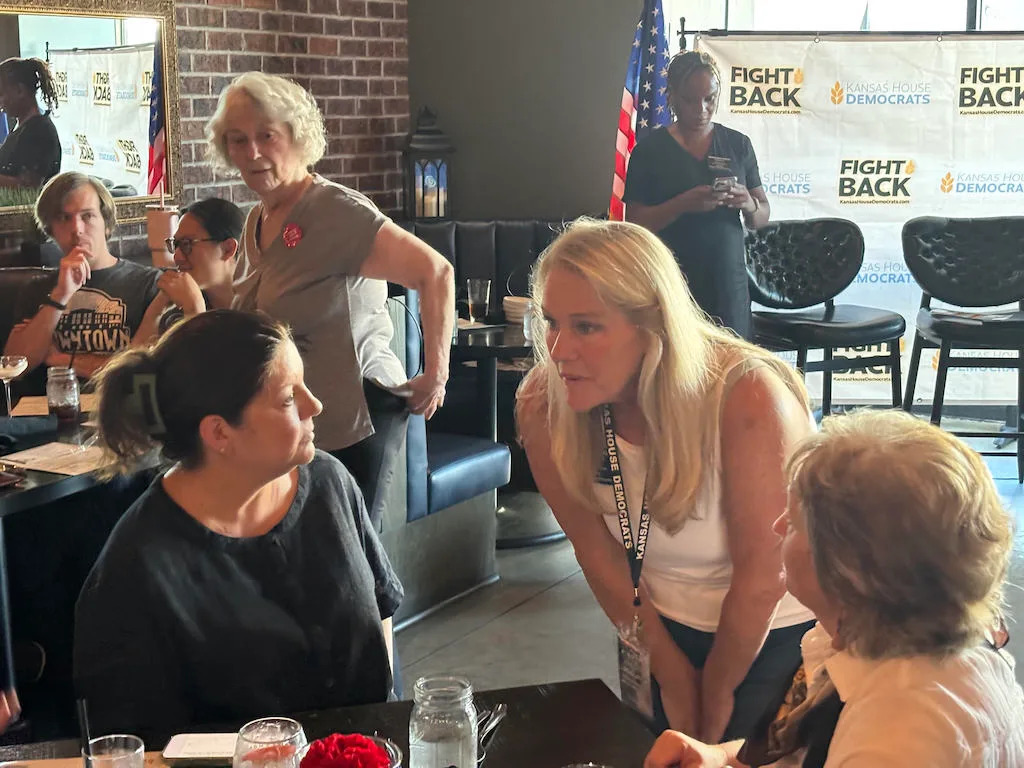 Kansas state Rep. Mari-Lynn Poskin speaks with attendees at the Kansas House Democrats’ “Fight Back” event.