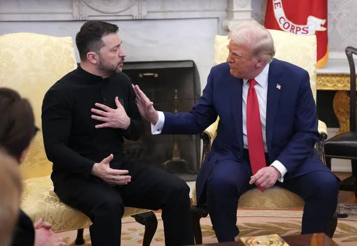 Two people are sitting on yellow chairs, engaged in a conversation inside an elegant room with military decor in the background