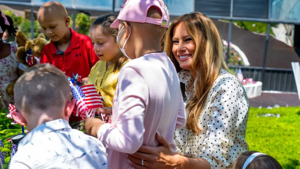 First lady Melania Trump helps children add July 4th decorations to the Bunny Mellon Healing Garden at Children's National Hospital on July 3 in Washington, DC. - Andrew Harnik/Getty Images