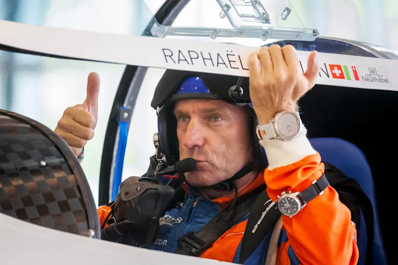 Swiss pilot Raphael Domjan gives a thumbs up prior to takeoff in his first attempt of the season at setting an aviation record by reaching an altitude of 10,000 meters onboard the solar-powered plane SolarStratos at the Sion airport, in Sion, southwestern Switzerland on Aug. 8, 2025.  / Credit: FABRICE COFFRINI/AFP via Getty Images