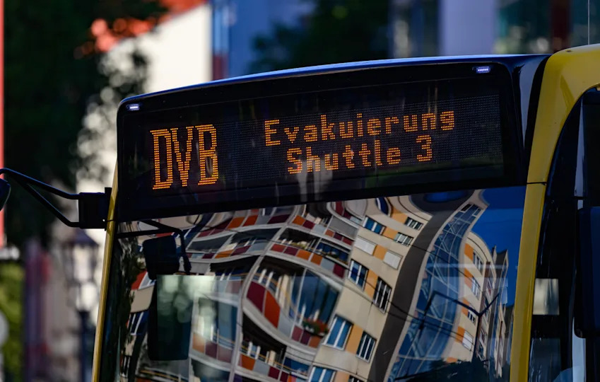 A shuttle bus from Dresden's public transport company (DVB) is available for citizens during an evacuation of the city center after a World War II bomb was found on Aug. 6, 2025 in Dresden. / Credit: Robert Michael/picture alliance via Getty Images