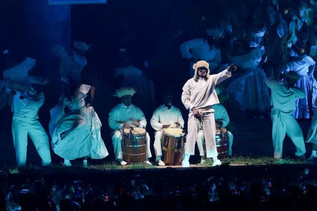 Kevin Mazur/Getty Bad Bunny performs onstage during Night One of Bad Bunny: