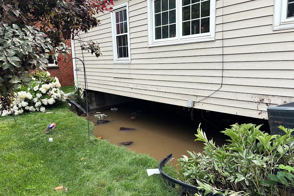 The collapsed foundation of Jean and Dave Krajewski's home in West Allis, Wisc., on Sunday. (Selina Guevara / NBC News)
