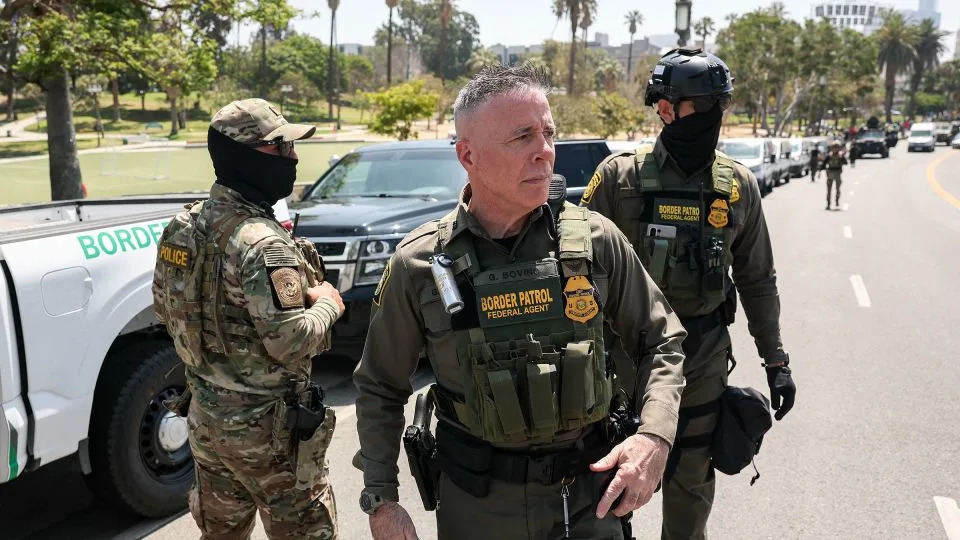 Gregory Bovino, US Border Patrol El Centro Sector Chief, walks in Los Angeles' MacArthur Park as a large group of federal law enforcement officers arrive on July 7, 2025. - Patrick T. Fallon/AFP/Getty Images/File