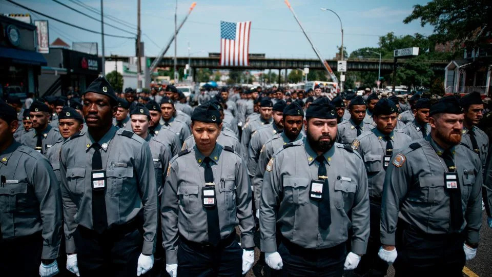 Police recruits stand in formation during the funeral services at the Parkchester Jame Masjid. - Eduardo Munoz/Reuters