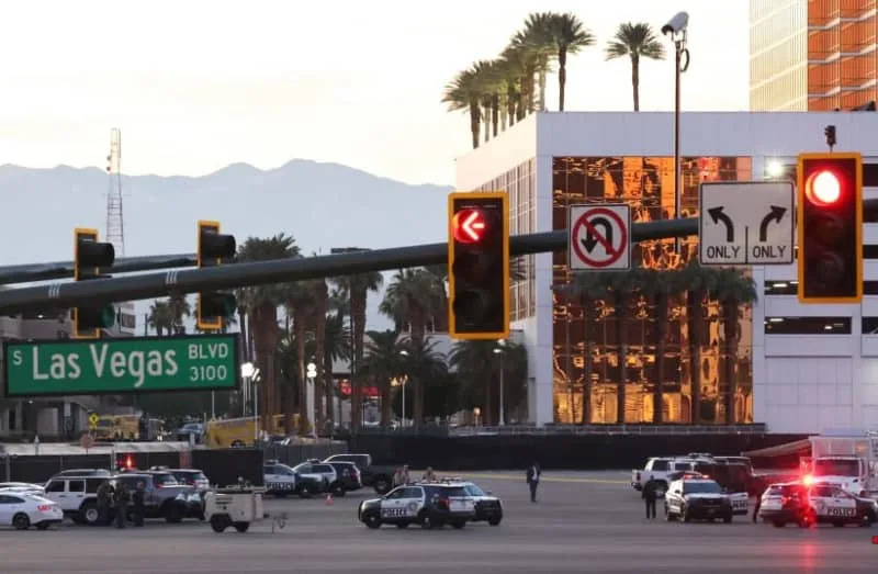 Police cars and officers stand in the car park of the Trump Tower, after a Tesla Cybertruck burned at the entrance of Trump Tower, in Las Vegas, Nevada, US January 1, 2025. (credit: REUTERS/Ronda Churchill)