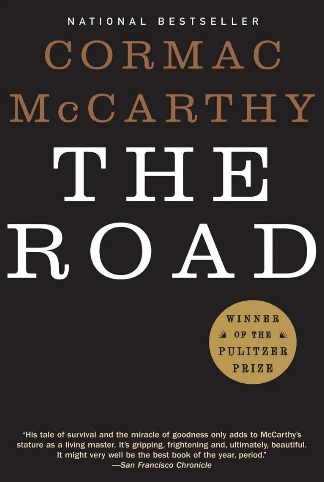 Book cover for "The Road" by Cormac McCarthy, highlighting its Pulitzer Prize win and a quote praising its beauty and storytelling