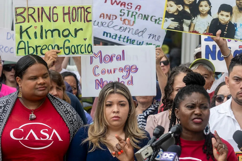 The wife of Kilmar Abrego Garcia, Jennifer Vasquez Sura, stands with demonstrators as they rally in support of Garcia outside federal court during a hearing in Greenbelt, Maryland. (Jim Watson/AFP via Getty)