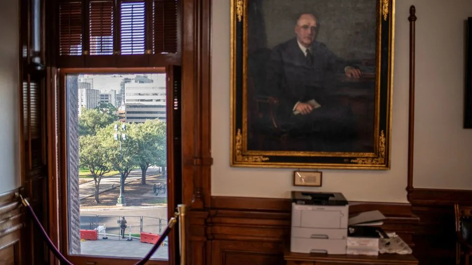 A member of the Texas Department of Public Safety stands outside the Texas State Capitol building in Austin, Texas, on August 13, 2025. - Sergio Flores/Reuters