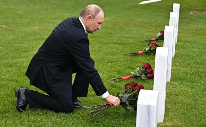 Russia's President Vladimir Putin lays flowers to the graves of Soviet soldiers who died during World War II at Fort Richardson National Cemetery. -/Kremlin/dpa