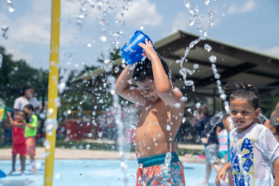 Noah Saharia, 7, of Westwood, cools himself down in over 90 degree heat with water at a splash pad at Milton A. Votee Park in Teaneck on Monday, June 23, 2025.