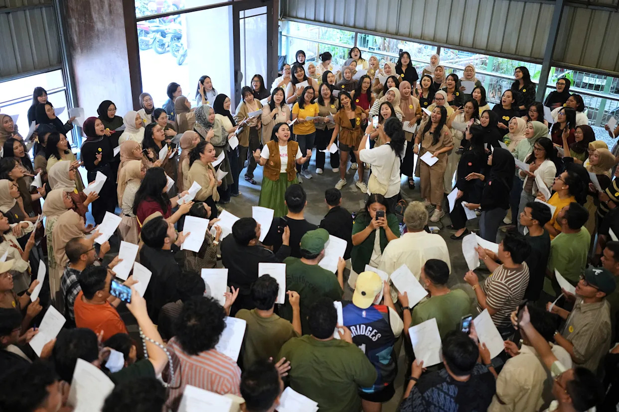 Photos show games, dancing and singing bringing people together in Indonesia